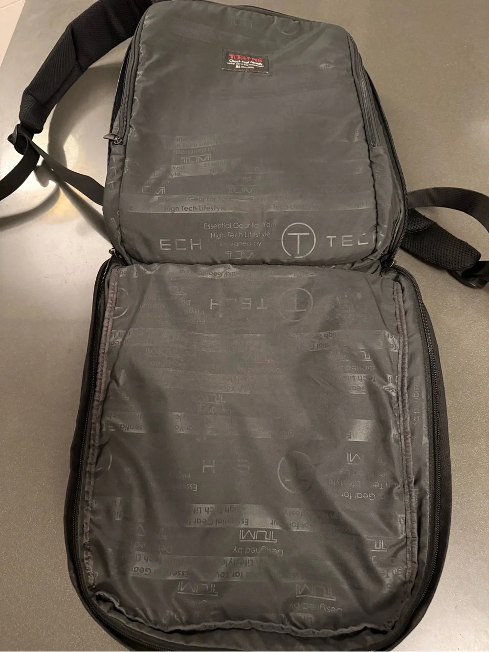 Tumi Black Tech Backpack with Subtle Red Accent